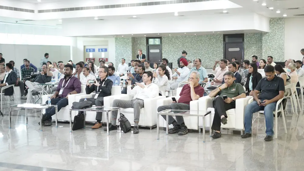 A wide view of the seated conference audience