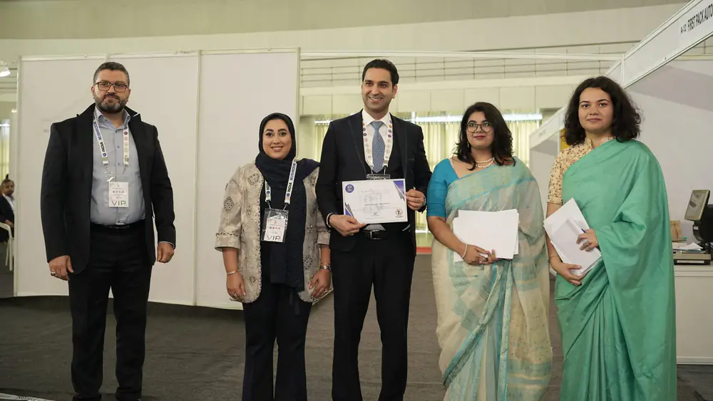 Certificates being presented to participants on stage