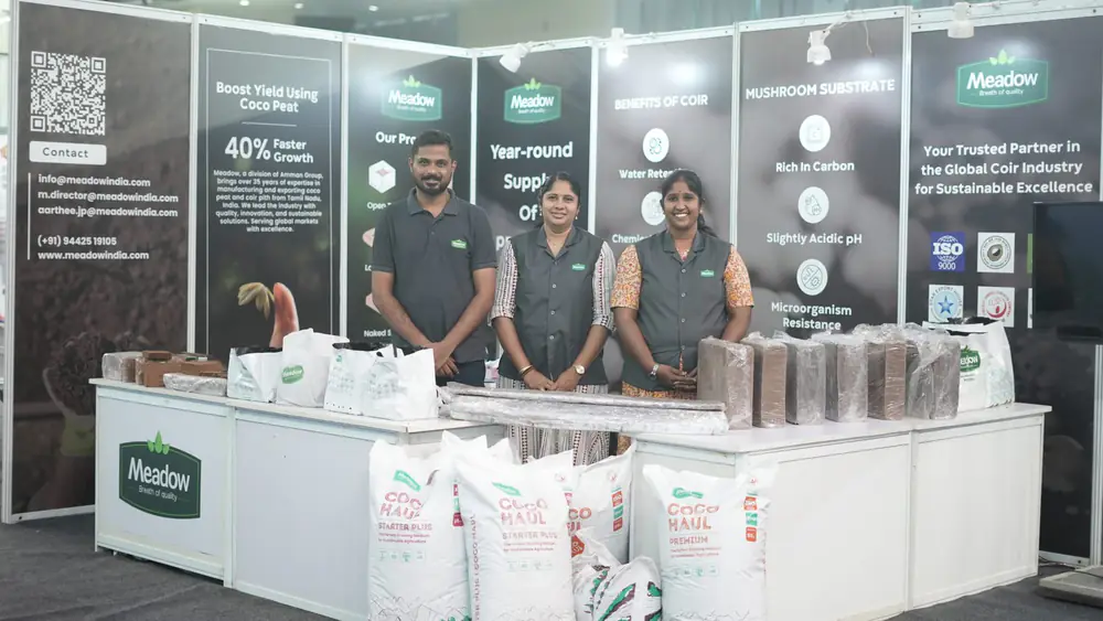 A substrate and coco peat supplier stand on the expo floor